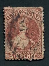 NEW ZEALAND 1862 Full Face Queen 6d Brown. Spacefiller. Perfs okay. Not torn. The postmark is unattractive. Cat val by CP with f