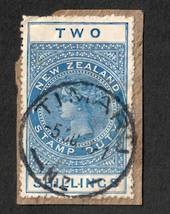 NEW ZEALAND 1882 Long Type Postal Fiscal 2/- Blue. On piece with genuine cancel. - 39270 - FU
