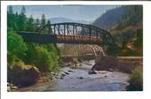 USA Coloured postcard of Streamliner crossing Feather River on the high bridge as highway traffic travels on the lower bridge. -