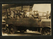 Real Photograph of of an early topless bus on a trip to Bournmouth. Sydenham shops behind. In a pile of cards addressed to Burne