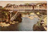 Coloured postcard of Th Bridge Whakarewarewa. Maori Children Diving for Pennies. - 45947 - Postcard