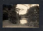 Real Photograph by Radcliffe of Recreation Grounds, Pukekura Park, New Plymouth. View of lake, bridge and dinghy. - 47004 - Post