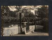 Real Photograph by Radcliffe of Recreation Grounds, Pukekura Park, New Plymouth. View thru gate of four people in a dinghy. - 47
