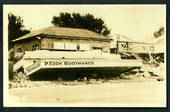 Photograph of wreckage of P Eddy Bootmaker. Napier Earthquake. - 47988 - Postcard