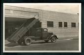 Superb Real Photograph of Tip Truck at Jolly and Mills Service Station Palmerston North. - 49701 - Postcard