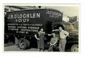 NEW ZEALAND Photograph of Truck and drivers of the firm J B O'Loghlen & Co Ltd. White border. Used as a postcard during the sale