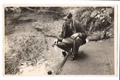 Real Photograph of Cave the N S W sprinter fedding trout at Fairy Springs. - 69771 - Postcard
