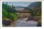 USA Coloured postcard of Streamliner crossing Feather River on the high bridge as highway traffic travels on the lower bridge. -