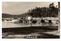 Real Photograph by T G Palmer & Son of Mansion House Bay Kawau Island. Wharf and Launches up close. - 44794 - Postcard