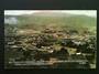 Coloured postcard. Complete Panoramic View of Waihi from above the Waihi Gold Mining Co Battery. The Grand Junction Battery is i