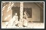 Real Photograph by N S Seaward of Maoris pose before a model hut Rotorua. - 49666 - Postcard
