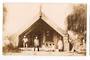 Real Photograph of Maori Whare and Inhabitants Rotorua. Signed by Guide Ella. - 69629 - Postcard
